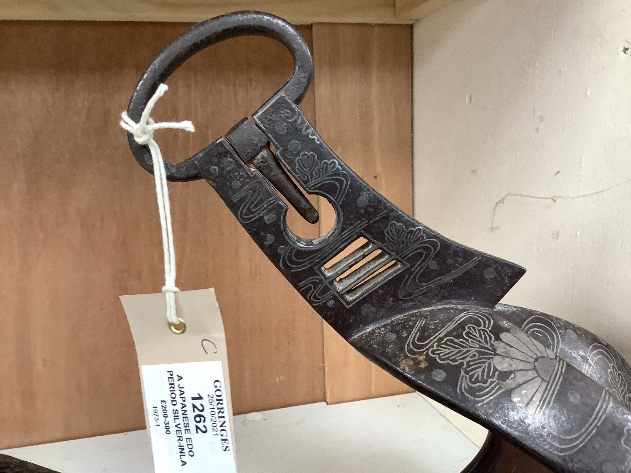 A Japanese Edo period silver-inlaid iron stirrup, 27cm